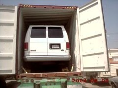 Vans loaded onto container