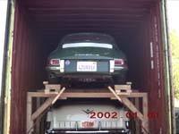 Porsche & Cadillac stacked in container