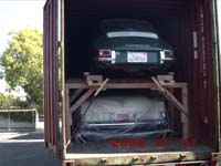 Porsche & Cadillac stacked in container 2