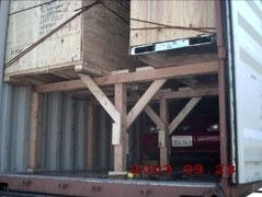 Crated motorcycles on platform deck